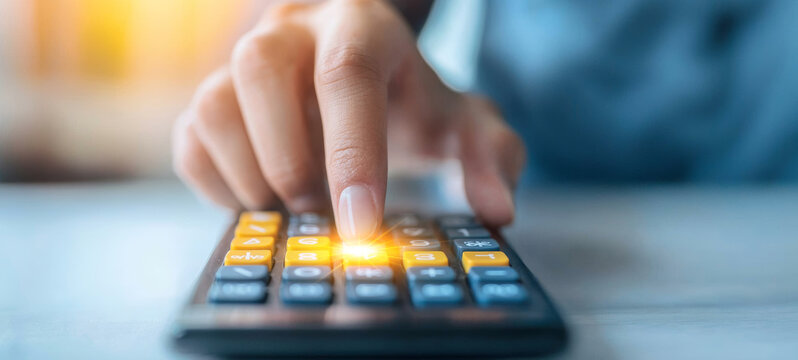 A close-up of a hand using a calculator, illustrating financial calculations and the importance of precision in numeric tasks.