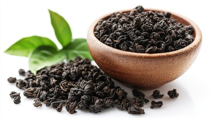 Close-up of dried tea leaves in a wooden bowl, showcasing their rich color and texture, perfect for beverage and culinary inspiration.
