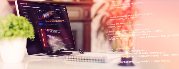 Programmer's program code on a computer screen. Web development and coding concept.