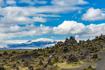 Selective focus with blurred background of Zen garden with stone pyramids by the Road 1 in Southern Iceland. Spiritual escapade