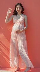 Fototapeta premium A middleaged pregnant Asian woman standing with on 130 dress, woman, fashion, beauty, model, long, hair, gown, glamour, person, elegance, bride, wedding, evening, elegant, people, red, lady, one, stu