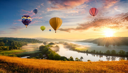 Obraz premium Hot Air Balloons Over a Serene Countryside at Sunrise