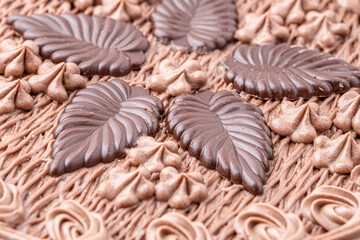 Chocolate bundt cake drizzled with chocolate ganache glaze.Front view of a triple layered chocolate cake .