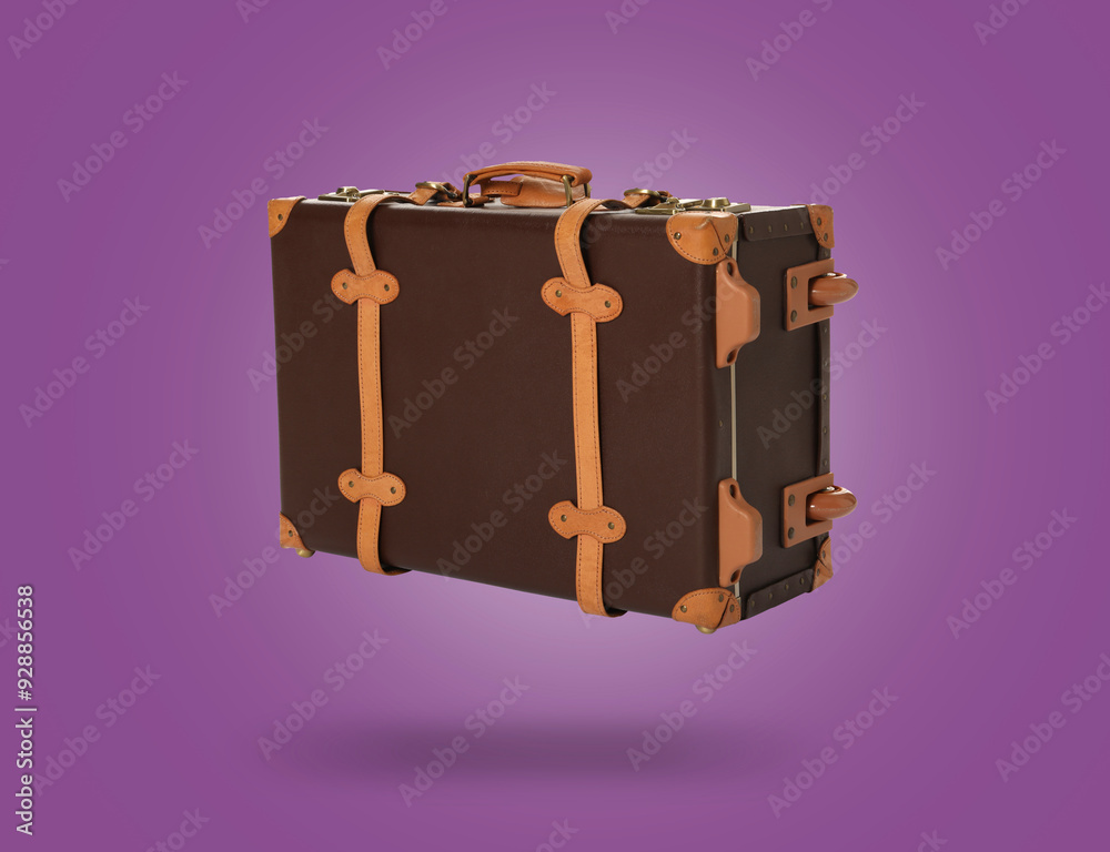 Sticker Vintage suitcase in air on purple background