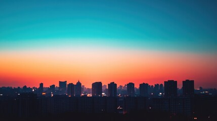 Naklejka premium A vibrant skyline at sunset with silhouettes of buildings against a colorful sky.