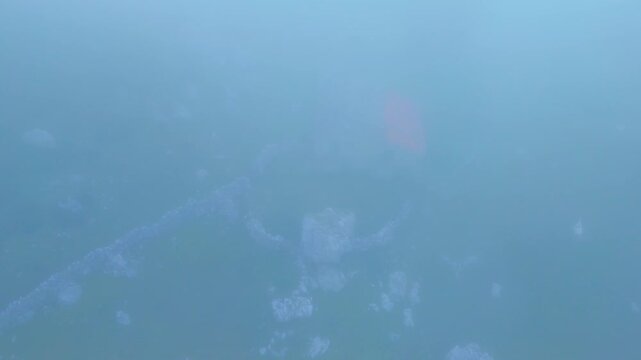 Fog in the spring landscape of pastures and Pasiegas cabins in the Natural Park of the Collados del As&oacute;n. Aerial view from a drone. Hills of Ason Natural Park. Soba Valley, Cantabria, Spain, Europe