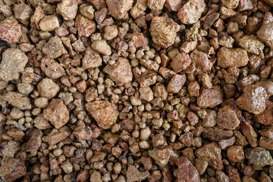 Bauxite ore, mining backgrounds concept. Mined for production of alumina, from which aluminium (aluminum) is produced