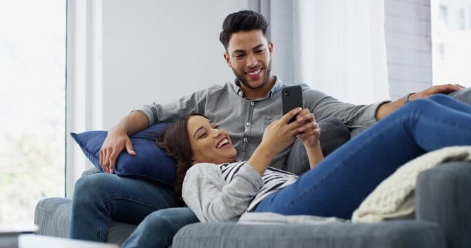 Couple, smartphone and social media on living room couch, memes and technology. Bonding together, happy and dating to relax, mobile app and texting for communication, streaming and connection