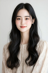 Elegant Portrait of a Young Woman with Bold Makeup and Wavy Hair