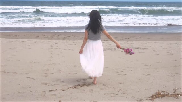 woman walking on the beach