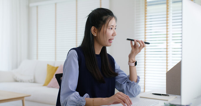 Asia people young casual woman remote work at desk home mobile phone call voice chat talk study learn MBA online class. SEO sale plan report on desktop PC reskill upskill career job smart workforce. - Powered by Adobe
