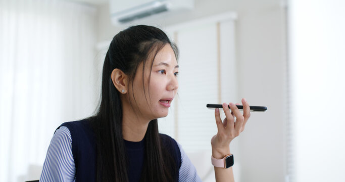 Asia people young casual woman remote work at desk home mobile phone call voice chat talk study learn MBA online class. SEO sale plan report on desktop PC reskill upskill career job smart workforce. - Powered by Adobe