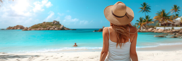 Woman relaxing on a tropical beach with clear blue water