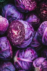 Obraz premium A bunch of purple cabbage sitting on a table, possibly for cooking or decoration