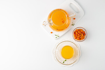 Sea buckthorn tea drink with oranges and mint. Autumn comfort hot drink. Herbal vitamin tea. 