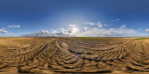 hdri 360 panorama on gravel road among fields in evening before sunset in equirectangular full...