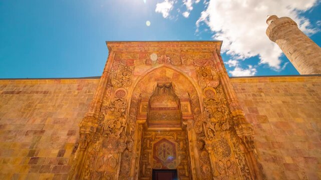 Minaret and main gate of Divrigi Ulu Camii or Great mosque of Divrigi timelapse 4k video.