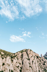 Majestic towering mountain peaks under a vibrant clear blue sky