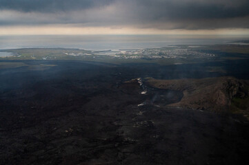 Grindavik Iceland and the steaming lava from the most recent volcanic eruption