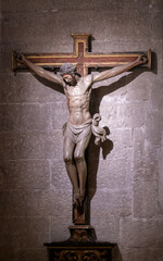 Sculpture depicting Christ crucified on the cross, inside the cathedral of Cuenca, Spain.