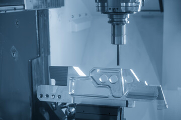 The 5-axis machining center cutting aerospace parts with solid flat nose end mill tool.