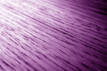 Fototapeta premium Oak wood texture with blur effect close up in violet stain