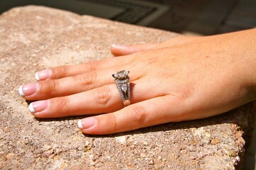Custom Diamond Engagement Ring on hand with French manicure