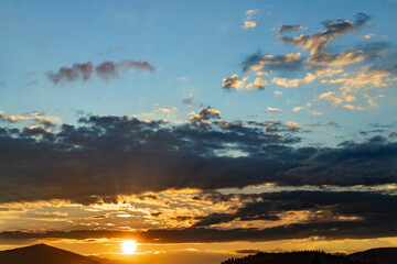 Beautiful landscape with clouds in the mountains at sunrise.