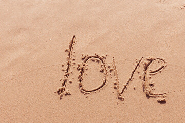 The inscription I love you on the seashore with palm trees