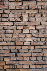 Vertical background of an old brick wall.