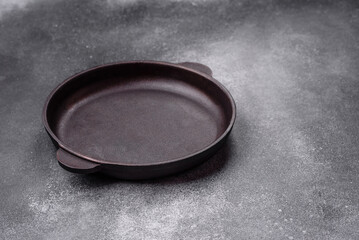 Empty ceramic plate on a dark textured background