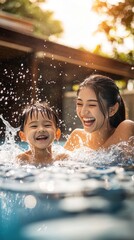 A mother and her son laugh and splash water while enjoying their time in a bright pool