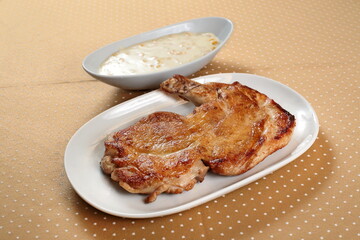 Grilled Capon Chicken with Creamed Corn on the plate
