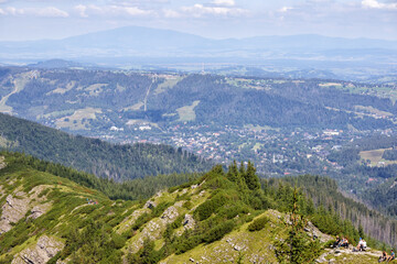 Obraz premium natural view from the top of the mountain to the city in the valley