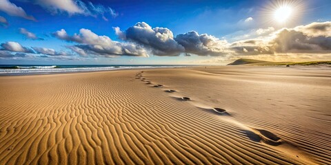 Naklejka premium Wind-blown sand covering abandoned footprints on a desolate beach , sand, wind, footprints, abandoned, beach, desolate, landscape