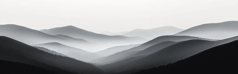 Fototapeta premium Serene rolling hills with misty background at dawn