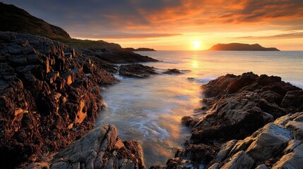 Golden Sunset Over Rocky Coastline