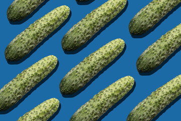 Pattern with a Cucumber on blue background	