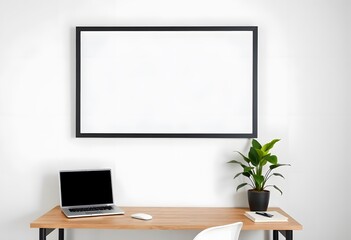A blank black picture frame on the wall wooden desk with a laptop, a potted plant, and a 