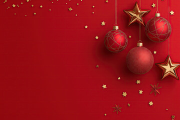 Red background with hanging Christmas balls and stars