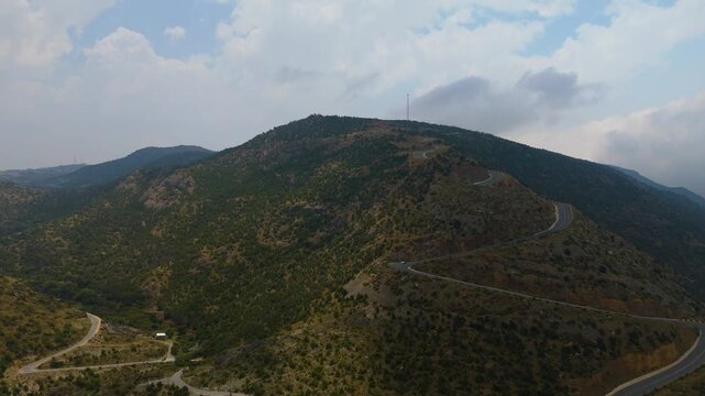 Stunning 4K drone footage of the Sarawat Mountains in Baha, Saudi Arabia. Capture the dramatic contrast of verdant peaks against a backdrop of swirling clouds. Ideal for travel, nature, and cinematic 