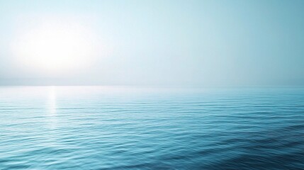 Obraz premium Tranquil Sea Horizon: A serene and calming image of a vast ocean at sunrise or sunset, with the sun shining brightly in the distance. 