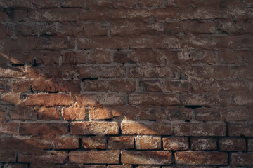 A brick wall with a shadow on it. The wall is old and has a rough texture. The shadow is cast on the wall, creating a sense of depth and dimension. Scene is somewhat somber and nostalgic