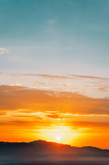Morning sunrise landscape with mountains horizon