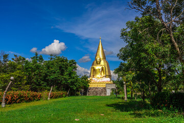 Background of religious tourist attraction, Wat Pa Dong Noi, in Noen Maprang District, Phitsanulok, Thailand, has a large Buddha statue for tourists to stop and make merit during their journey.