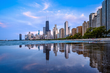 the reflected skyline of chicago during sunset