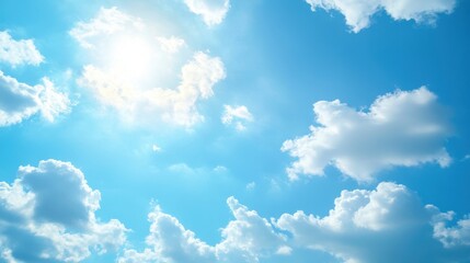 A bright blue sky filled with fluffy white clouds and sunlight.
