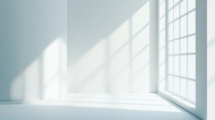 Obraz premium A bright, minimalist room with large windows casting shadows on the floor.