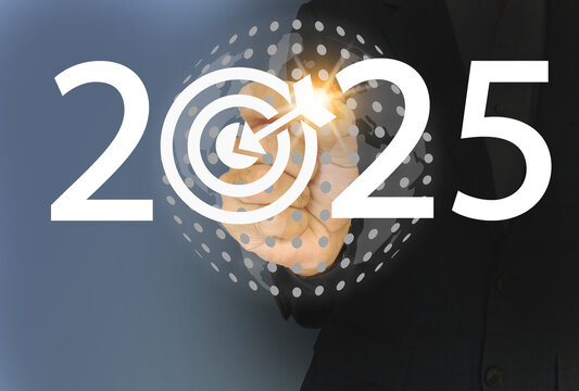 Man touching the virtual screen having globe and "starting 2025".