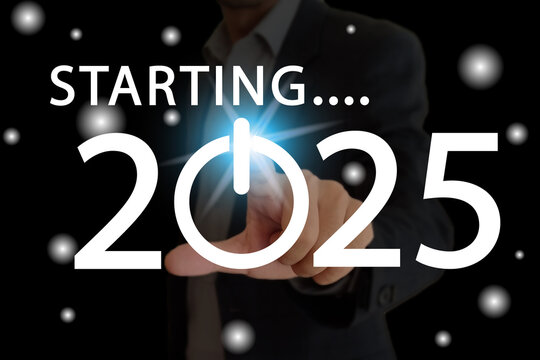 Man touching the screen having starting 2025 and button icon.